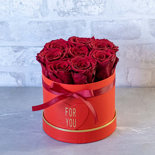 Red roses in a red box with 'FOR YOU' text on a light gray background